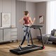 Folding treadmill with 3.75HP motor, LCD display, and Bluetooth for home workouts, shown in a modern living room.