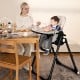Multifunctional 4-in-1 baby high chair in gray, featuring adjustable height and removable double trays for easy feeding.