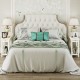 White 2-tier end table with pull-out tray and solid rubber wood legs, perfect for bedroom or living room storage.