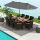 11-piece patio dining set featuring a large acacia wood table, stackable chairs, and a 15 ft double-sided umbrella for.