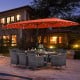 11-piece patio dining set featuring a 15-foot orange umbrella, gray PE rattan chairs, and acacia wood table for outdoor.