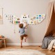 Owl activity wall busy board with 11 learning activities for toddlers, promoting skills like math and shoelace tying.