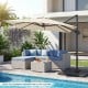 Beige 11 x 9 FT cantilever patio umbrella with 360° rotation, placed by a poolside seating area for outdoor shade.
