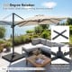 Beige 11 x 9 FT cantilever patio umbrella with 360° rotation, positioned over a stylish outdoor seating area.