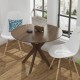 Round wood dining table with intersecting pedestal base, 36 inches, ideal for family gatherings in home or café.