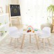 Modern kids activity play table with two white chairs and beech legs, perfect for playroom or nursery use.
