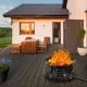 Portable propane fire pit with flames, sturdy iron construction, perfect for camping and outdoor gatherings.