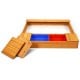 Cedar sandbox with detachable seats and two plastic storage boxes for kids' toys, ideal for outdoor play and creativity.