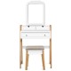 Vanity table set with cushioned stool, large mirror, and three drawers for organized storage and elegant home decor.