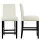 Beige kitchen chairs with rubber wood legs, featuring a soft cushion and curved backrest for comfort and support.