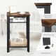 Industrial end table featuring a rustic top, heavy-duty steel frame, and adjustable feet for stability in any room.