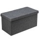 Dark gray foldable storage ottoman with padded seat and roomy interior for blankets, clothes, and toys, ideal for any.