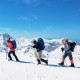 Lightweight 21-inch snowshoes with ski poles, designed for maximum flotation and easy movement on snow.