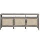Gray TV stand with solid wood legs and rattan cabinet doors, featuring adjustable shelves for versatile storage options.