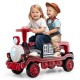 Two children riding a red 12V train toy with removable chair, featuring a steering wheel and fun sound effects.
