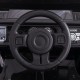 Anti-slip steering wheel of the 12V electric kids ride-on truck with remote control, designed for easy operation.
