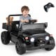 Electric 12V ride-on truck in black with dump bed, remote control, and music features for kids aged 3-6 years.