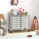 Rolling storage cart with 12 transparent drawers, metal frame, and wheels, ideal for home or office organization.