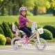 12-inch girls bike in pink with doll seat, streamers, and training wheels, perfect for children aged 3-4 years old.