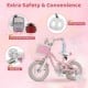 Close-up of the pink 12-inch kids bike with adjustable seat, basket, streamers, and safety reflectors for girls.