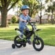 Kids' 12-inch black bike with race styling, adjustable handlebar, training wheels, and pneumatic tires for ages 3-4.