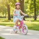 A girl riding a pink 12-inch kids bike with training wheels, designed for ages 3-8, in a sunny park setting.