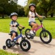 Two kids riding 12-inch bikes, one pink with training wheels, showcasing adjustable features for comfortable riding.