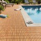 Acacia wood interlocking deck tiles shown on a poolside, ideal for enhancing outdoor spaces with natural beauty.
