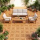 Acacia wood interlocking deck tiles in a patio setting, showcasing waterproof design and natural beauty for outdoor use.