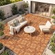 Acacia wood interlocking deck tiles in a patio setting, showcasing 12" x 12" waterproof tiles for outdoor use.