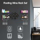 Wall-mounted wine rack set in black with shelves, storing eight bottles and displaying glasses, plants, and decor.