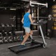 Folding treadmill with LED display, adjustable speed, and shockproof running belt for home workouts.