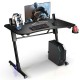 Height adjustable gaming desk with carbon fiber surface, blue LED lights, and sturdy Z-shaped legs for stability.