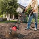 14-inch electric tiller with a 10-amp motor, ideal for small gardens, shown in use on soil with ergonomic handles.