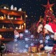 Outdoor waterproof Christmas snowflake LED projector lights creating snow flurries, perfect for festive decorations.