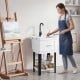 Utility sink with rotating faucet and adjustable legs, ideal for laundry and gardening, featuring a large 14.5 Gal.