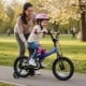 14-inch navy kids bike with removable training wheels, featuring a soft-padded saddle and kickstand for easy parking.