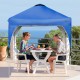 Blue 6.6 x 6.6 FT pop-up canopy tent with adjustable height, providing shade for outdoor activities on a patio.
