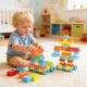 Toddler building blocks set with 150 colorful pieces, including wheels for vehicle creation and STEM learning fun.