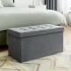 Light gray fabric foldable storage ottoman with padded seat, ideal for storing clothes and blankets in any room.