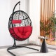Hanging cushioned hammock chair with stand in red, featuring a sturdy frame and comfortable pillows for indoor or.