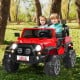 Red 12V 2-seater ride-on car with remote control, storage space, and LED lights, perfect for outdoor fun.