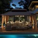 Spacious 16x12FT hardtop gazebo with aluminum frame, curtains, and netting, ideal for outdoor relaxation by the pool.