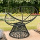 Rattan Papasan chair with ergonomic design and dark red cushion, featuring a durable steel frame for indoor and outdoor.