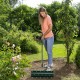 Manual lawn aerator with detachable handle and galvanized steel spikes, ideal for loosening soil in gardens.