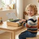Child playing the 18 keys wooden piano for kids, featuring a removable music stand, perfect for educational fun.