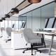 Gray linen accent adjustable rolling swivel office chair with armrest, designed for comfort and style in home or office.