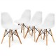 Set of four white modern plastic hollow chairs with beech wood legs, perfect for dining rooms or contemporary spaces.