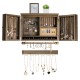 Vintage wood wall-mounted jewelry organizer with barn doors, featuring hooks and mesh for necklaces and earrings.