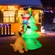 Inflatable 6.5 feet Christmas tree with Santa and LED lights, perfect for outdoor holiday decorations.